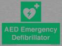 green-background-with-white-text-and-heart-defibrillator-symbol--white-cross-and~